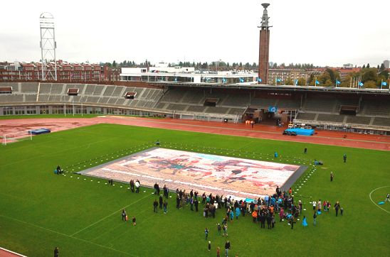 A huge jigsaw mosaic depicting top-flight Dutch footballers in a stadium in Amsterdam